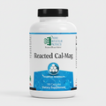 Supplement bottle labeled 'Reacted Cal-Mag' by Ortho Molecular Products on a white background