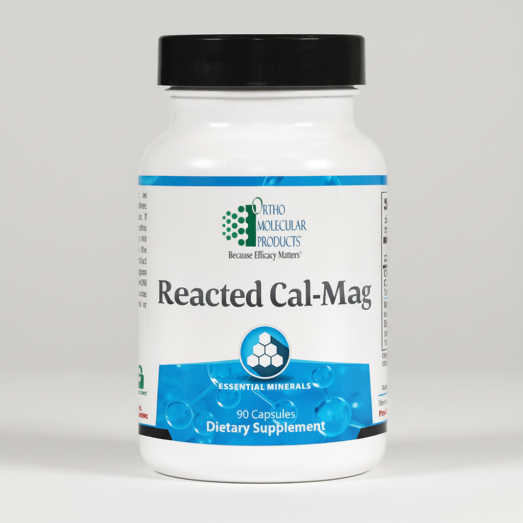 Supplement bottle labeled 'Reacted Cal-Mag' by Ortho Molecular Products on a white background
