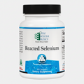 Supplement bottle labeled 'Reacted Selenium' by Ortho Molecular Products on a white background