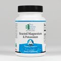 Supplement bottle labeled 'Reacted Magnesium & Potassium' by Ortho Molecular Products on a white background.