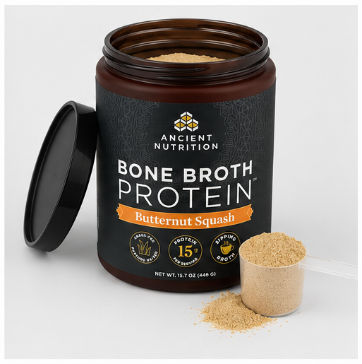 Ancient Nutrition Bone Broth Protein powder in a dark amber jar with a black lid leaning beside it, shown on a light gray background with a small scoop and loose powder in front.