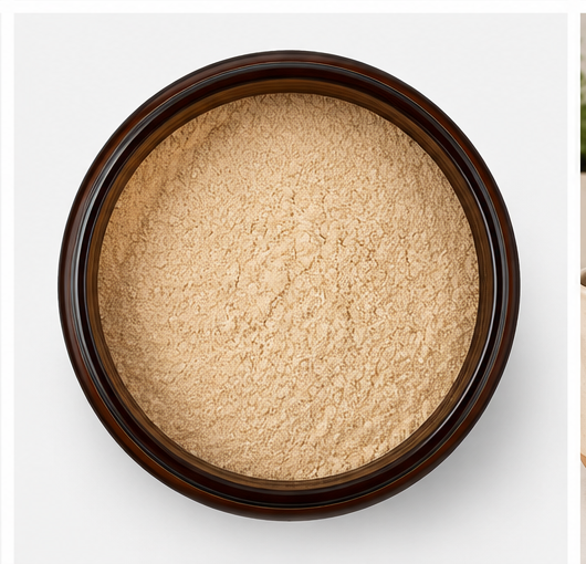 A top-down view of a dark brown jar filled with a fine beige powder, set against a plain white background.
