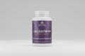 Supplement bottle labeled 'Colostrum + Collagen' by Ancient Nutrition on a white background