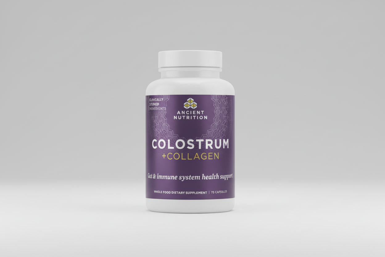 Supplement bottle labeled 'Colostrum + Collagen' by Ancient Nutrition on a white background