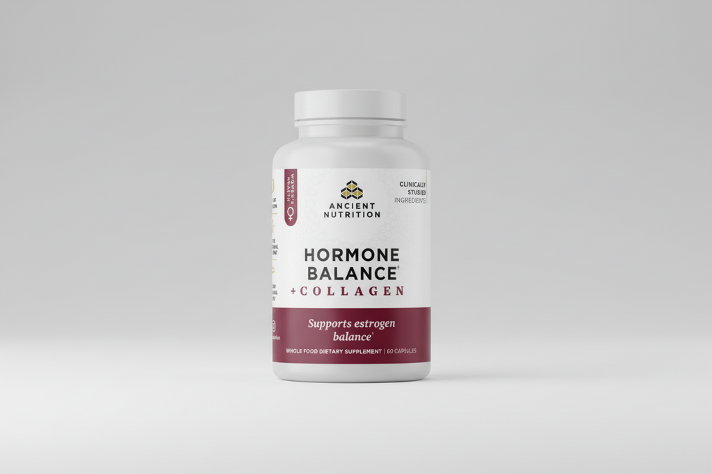 Supplement bottle labeled 'Hormone Balance + Collagen' by Ancient Nutrition on a white background