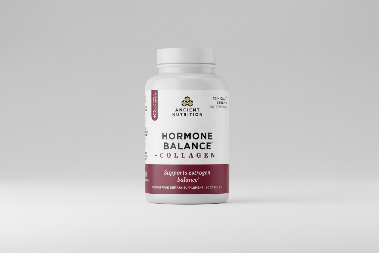 Supplement bottle labeled 'Hormone Balance + Collagen' by Ancient Nutrition on a white background
