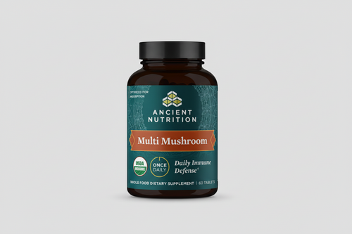 Supplement bottle labeled 'Ancient Nutrition Multi Mushroom' on a white background
