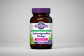 Vitamin supplement bottle labeled 'Ashwagandha Ginkgo' with a purple cap and white label.