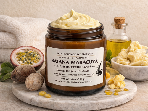 Jar of Batana Maracáé hair buttercream with ingredients on a marble board
