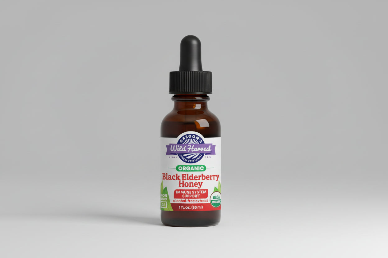 Bottle of Oregon's Wild Harvest Black Elderberry Honey with dropper on a white background