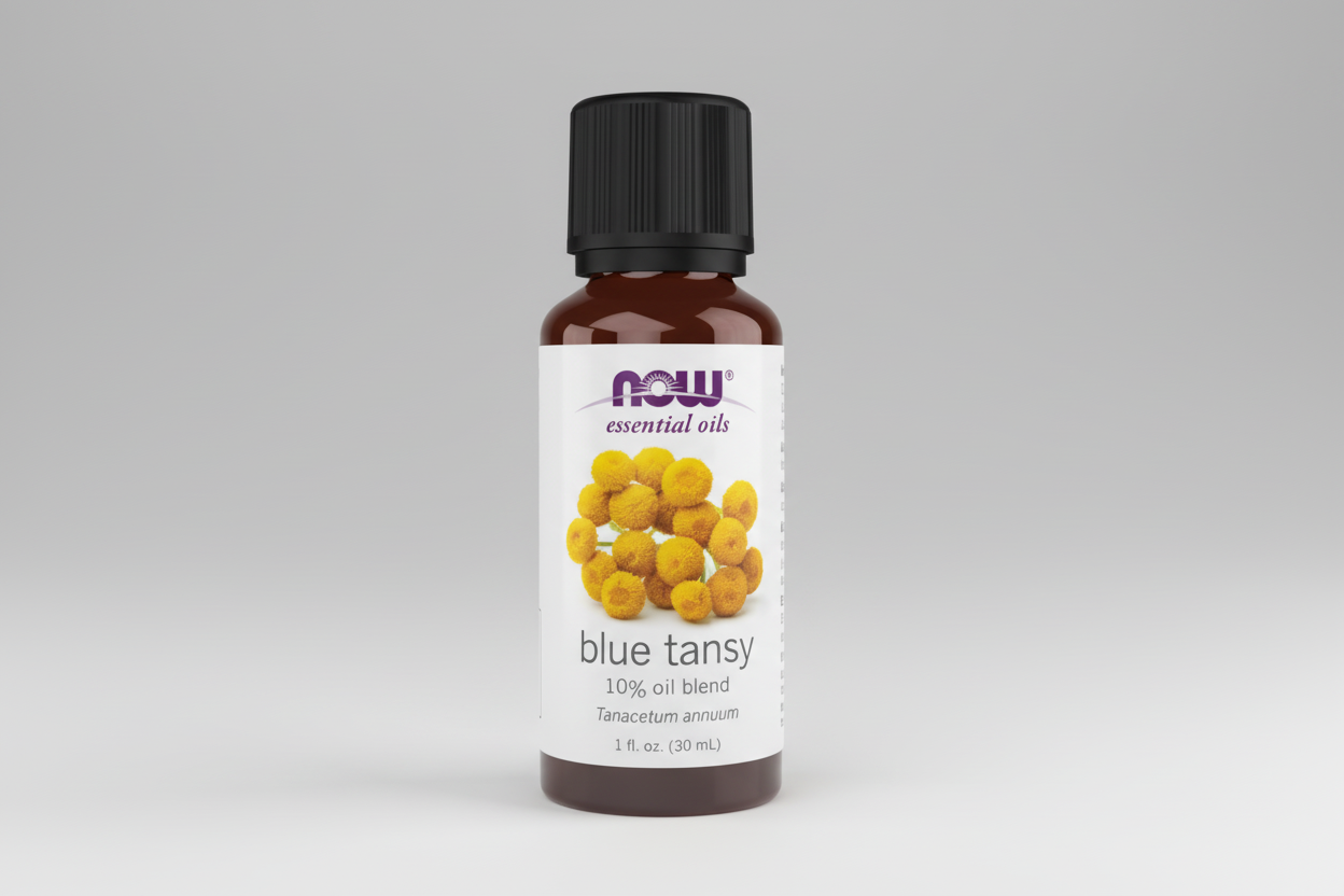 Bottle of NOW Essential Oils Blue Tansy oil blend on a white background