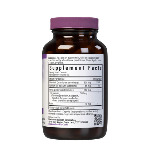 Brown supplement bottle with purple cap and label on a white background