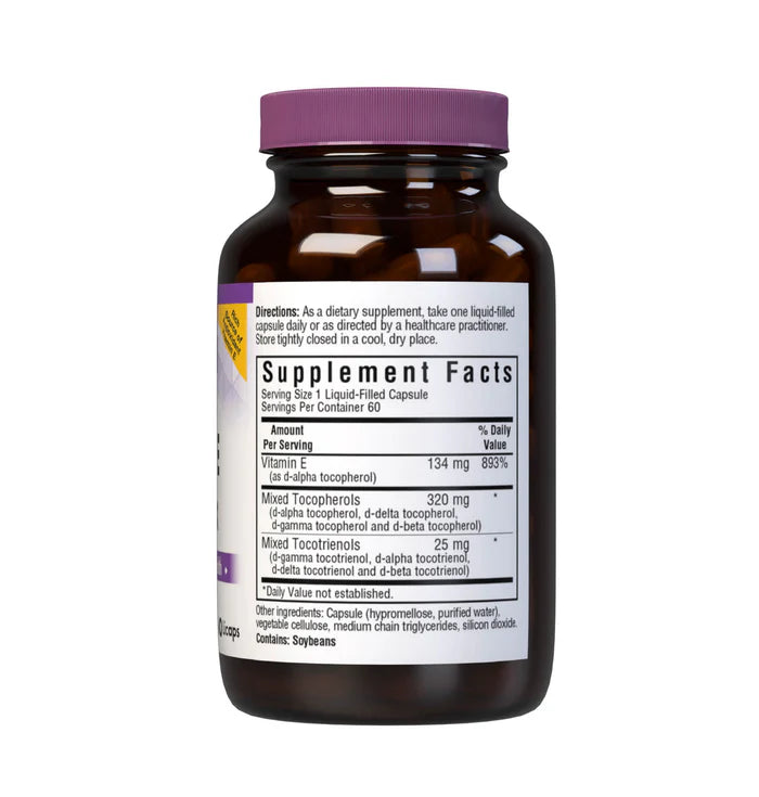 Vitamin supplement bottle with purple cap and label on a white background