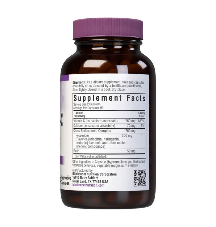 Vitamin supplement bottle with purple cap and label on a white background