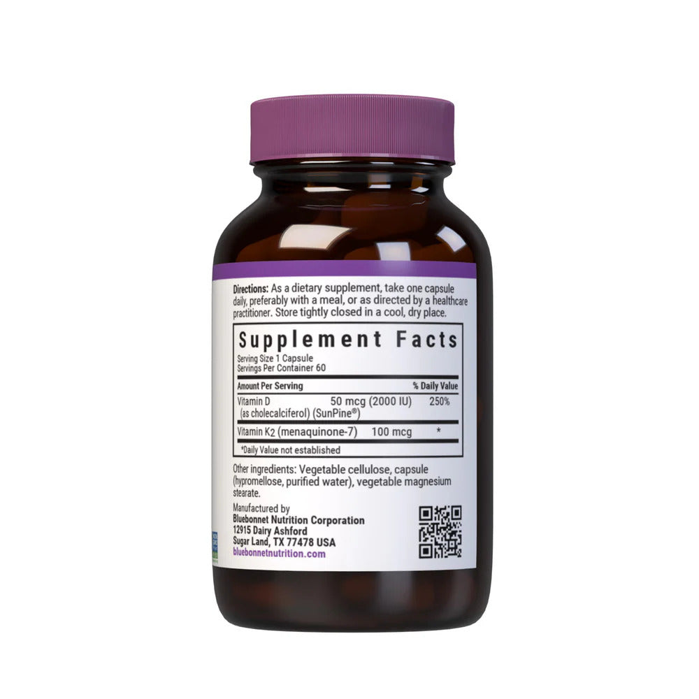 Vitamin supplement bottle with purple cap and label on a white background