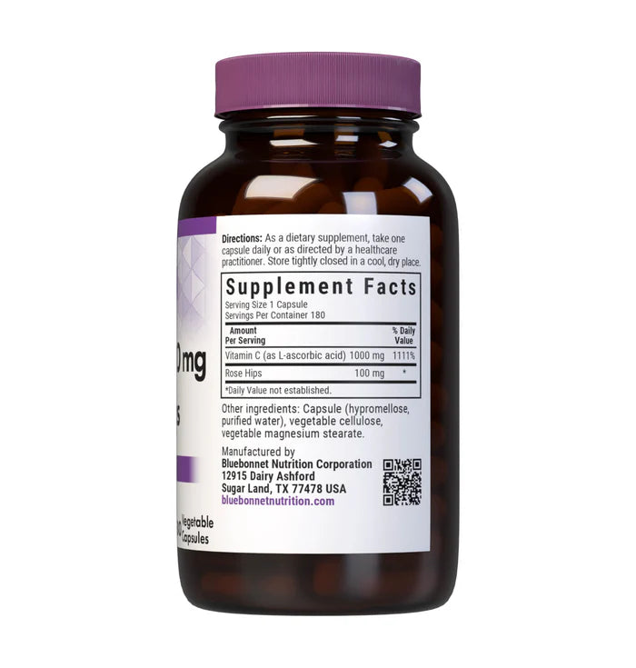 Vitamin supplement bottle with purple cap and label on a white background