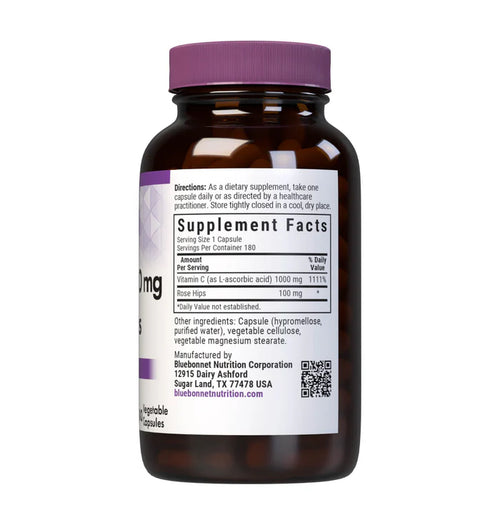Vitamin supplement bottle with purple cap and label on a white background
