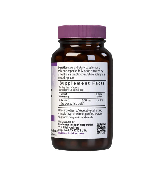 Brown supplement bottle with purple cap on a white background