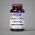 Vitamin C-500 mg & Rose Hips supplement bottle with purple label on a white background