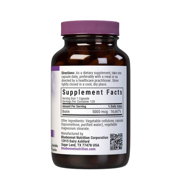 Brown supplement bottle with purple cap and label on a white background