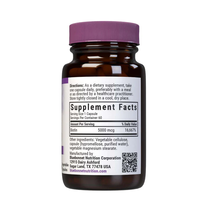 Brown supplement bottle with purple cap on a white background