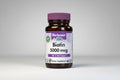 Bluebonnet Biotin supplement bottle with purple cap on a white background
