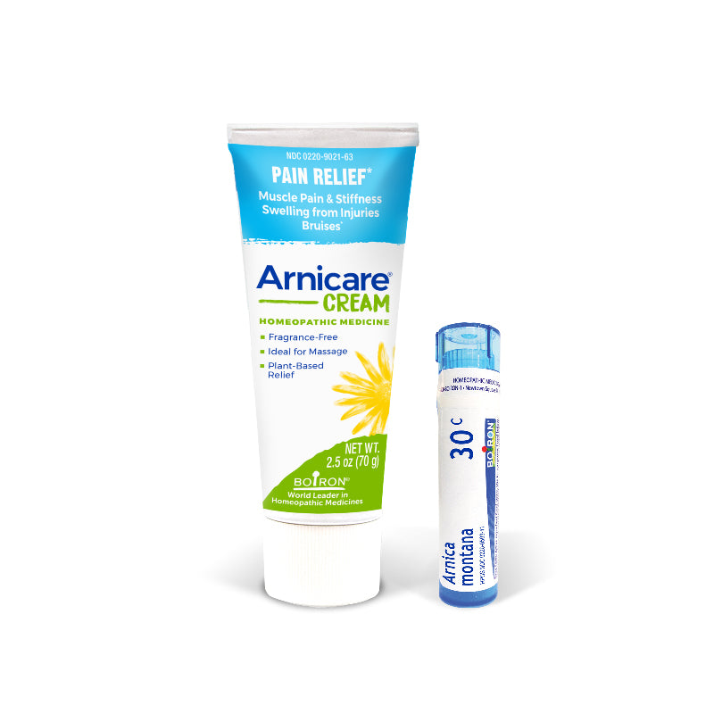 Arnicare Cream tube and Arnica Montana vial on a white background