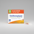 Oscillococcinum homeopathic medicine packaging with a single dose tube on a white background