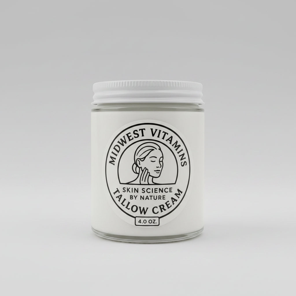 Jar of Midwest Vitamins Tallow Cream on a wooden surface with a white background