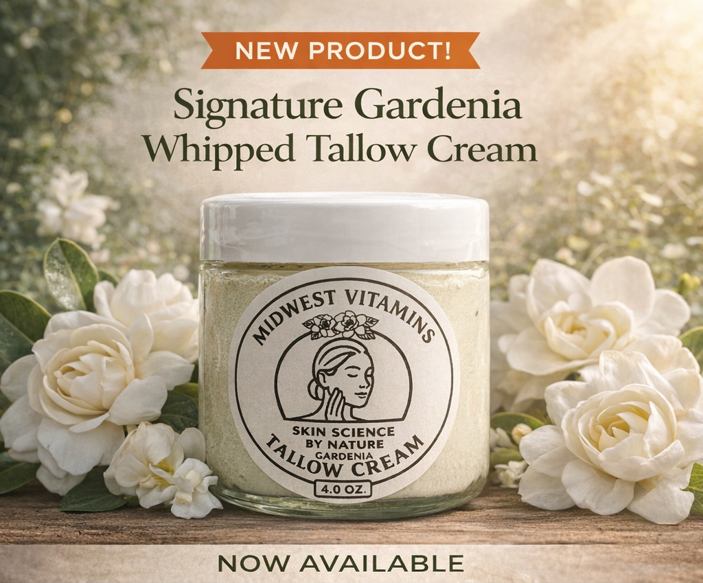 Jar of Midwest Vitamins Signature Gardenia Whipped Tallow Cream with flowers in the background