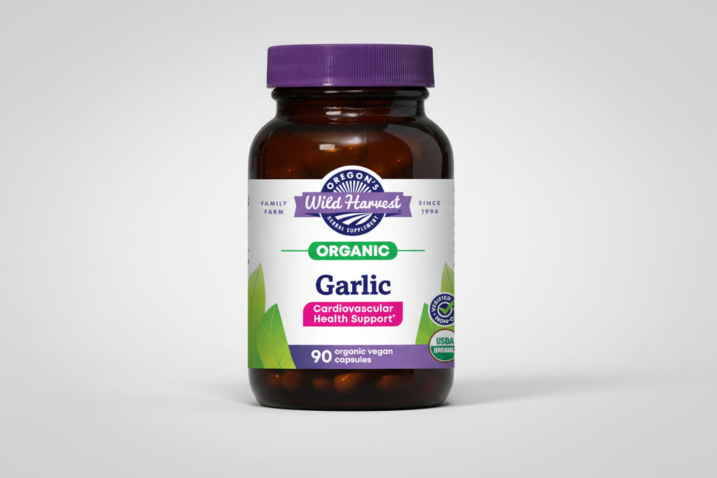 Oregon's Wild Harvest Garlic supplement bottle with purple cap and label.