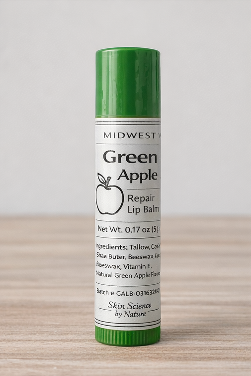 Green Apple lip balm on a wooden surface with a white background