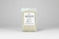 Bag of organic sea salt with a label on a white background