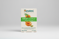 Himalaya Koflet Lozenge packaging with oranges and cardamom on a beige background