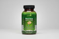 Irwin Naturals Bloat-Away supplement bottle on a grass background