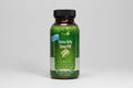 Bottle of Irwin Naturals Stress-Defy Sleep PM supplement on a white background