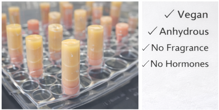 Test tubes in a rack with labels indicating vegan, anhydrous, no fragrance, and no hormones.