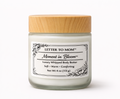 Jar of 'Moment in Bloom' body butter with a wooden lid on a white background