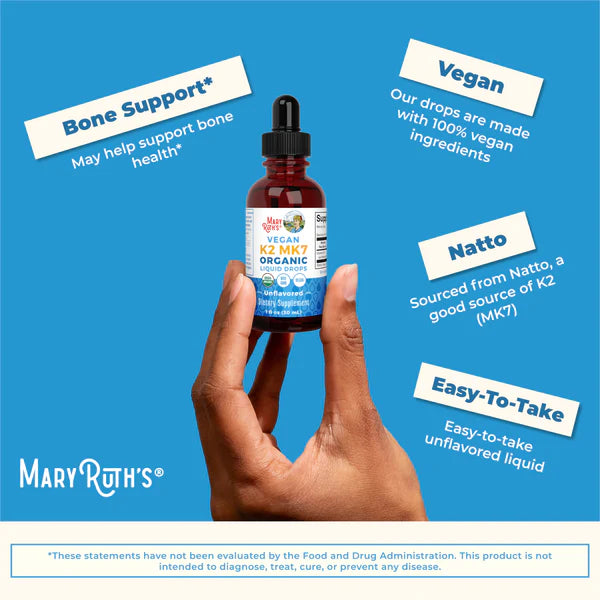 Hand holding a bottle of Mary Ruth's Natto Organic product with text on a blue background