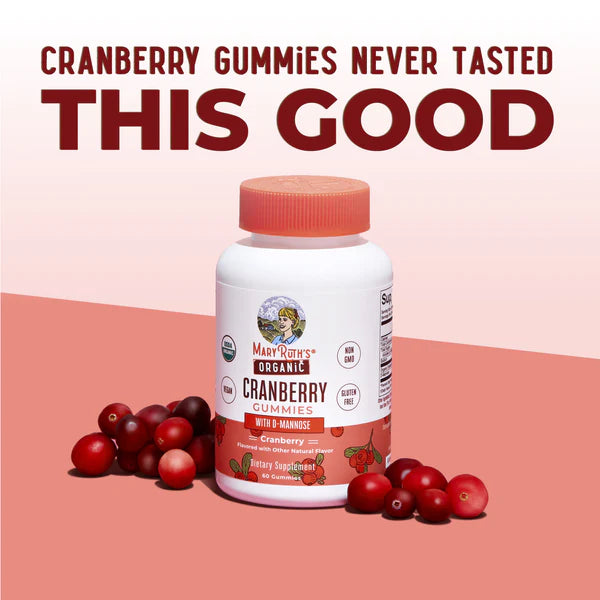 Bottle of Max & Ruby's Organic Cranberry Gummies with cranberries on a pink background