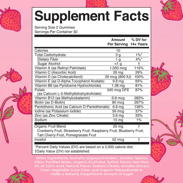 Supplement facts label with vitamins and nutrients on a pink background with strawberry illustrations
