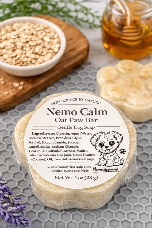 Nemo Calm Oat Paw Bar soap with ingredients label on a textured surface with honey and oats.