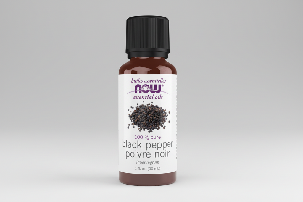 Bottle of black pepper essential oil with NOW brand on a white background