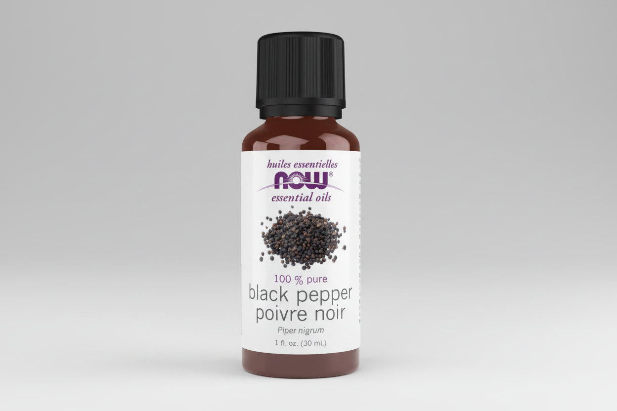Bottle of black pepper essential oil with NOW brand on a white background
