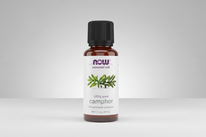 Bottle of NOW essential oils camphor on a white background