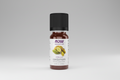 Bottle of NOW essential oils with cardamom flavor on a white background
