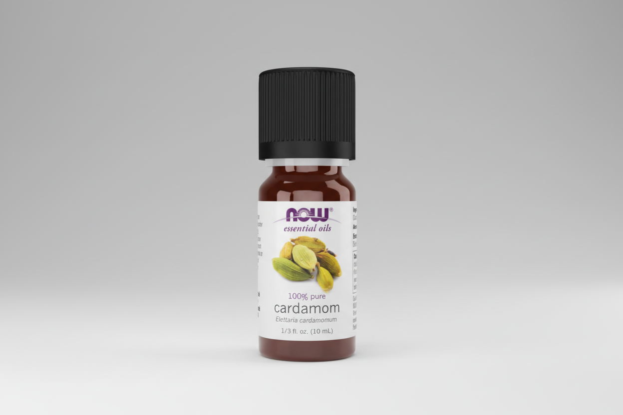 Bottle of NOW essential oils with cardamom flavor on a white background