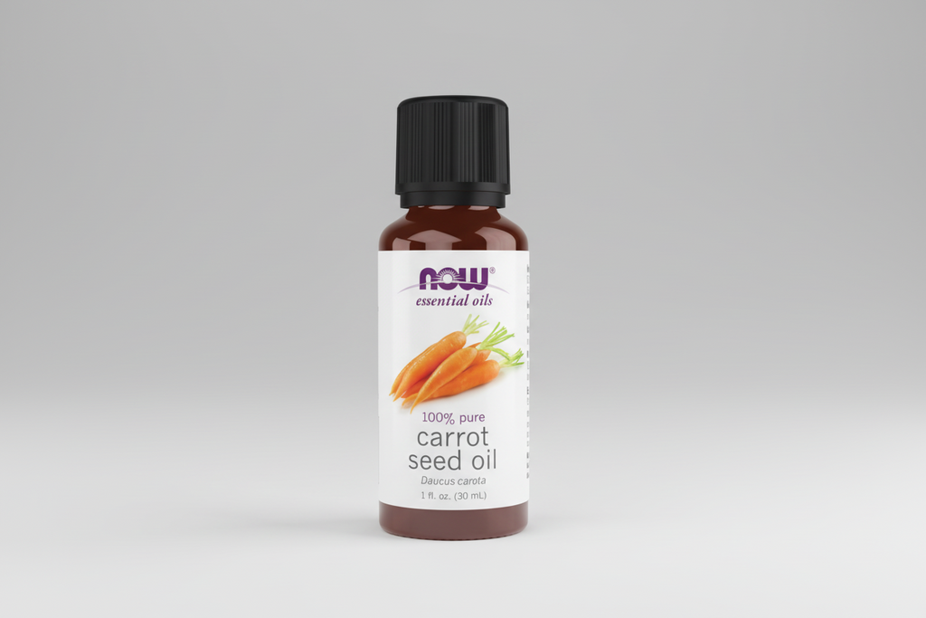 Bottle of NOW essential oils carrot seed oil on a white background