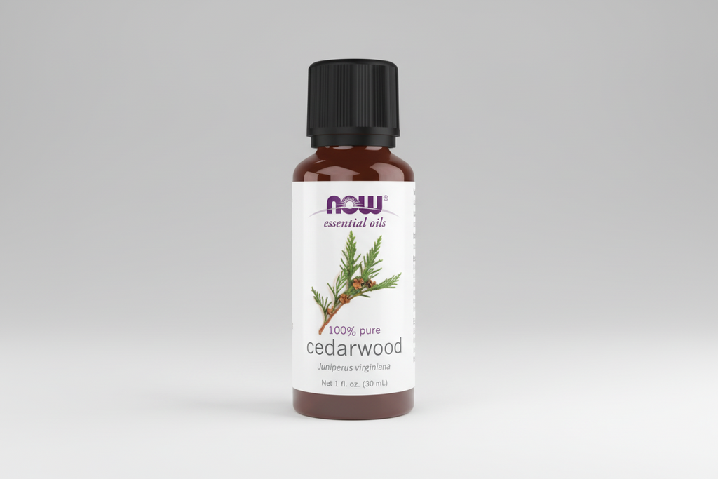 Bottle of NOW Essential Oils Cedarwood oil on a white background