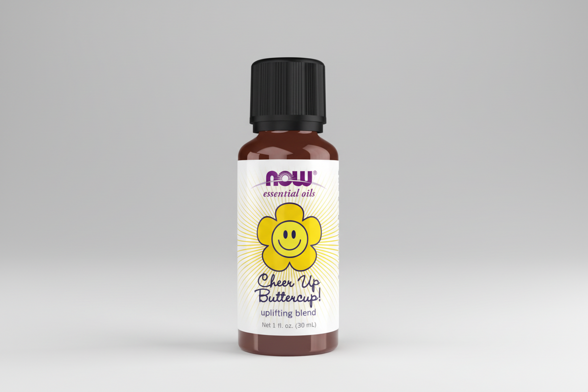 Bottle of NOW Essential Oils 'Cheer Up Buttercup!' on a white background